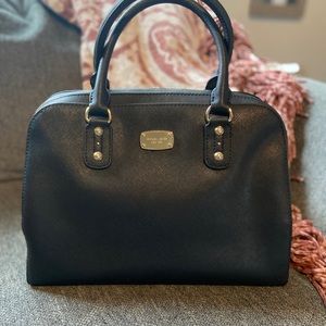 Black Michael Kors handbag. Gold zipper